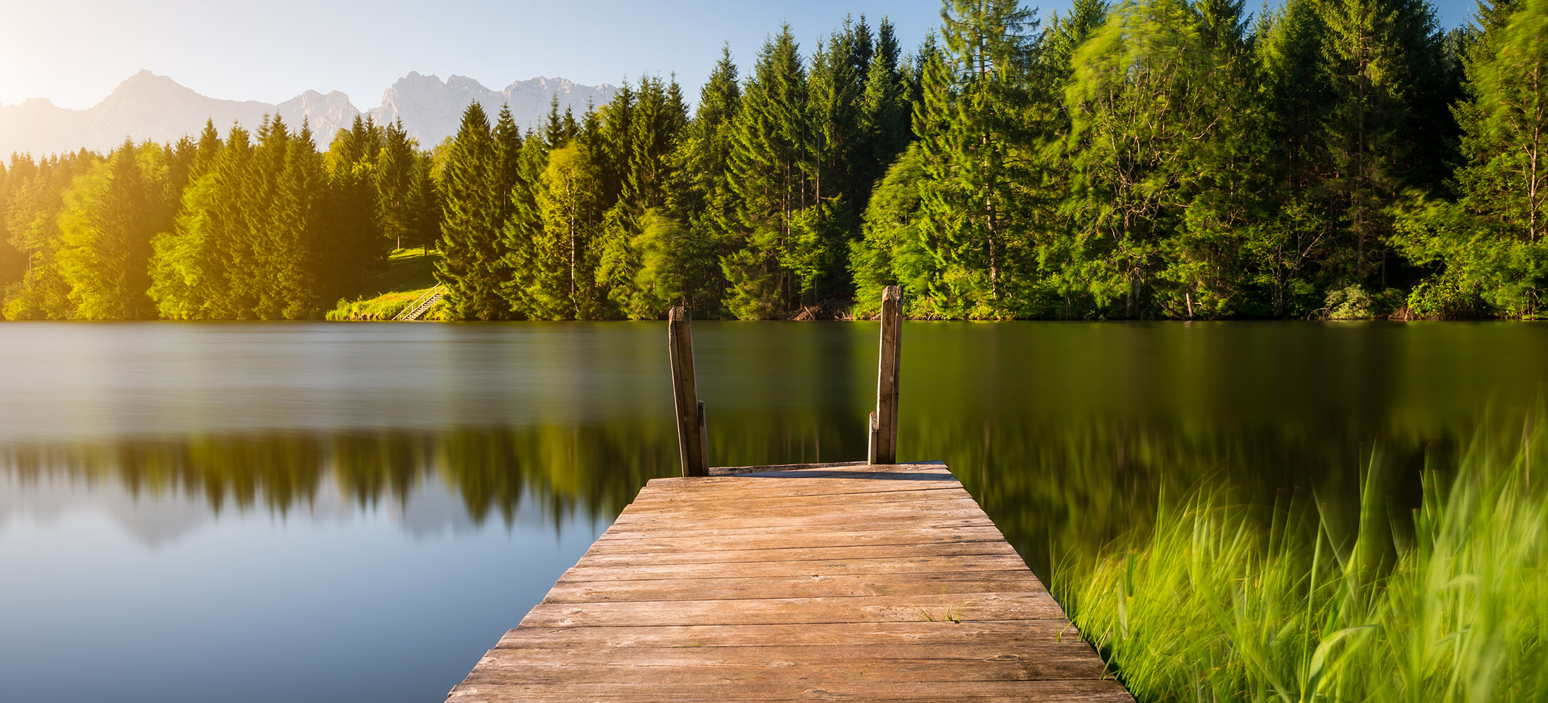 Idyllic,View,Of,The,Wooden,Pier,In,The,Lake,With